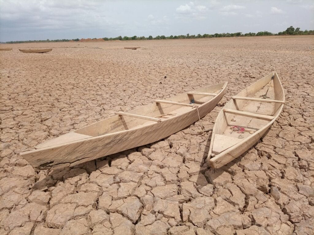 two boats in a drought land